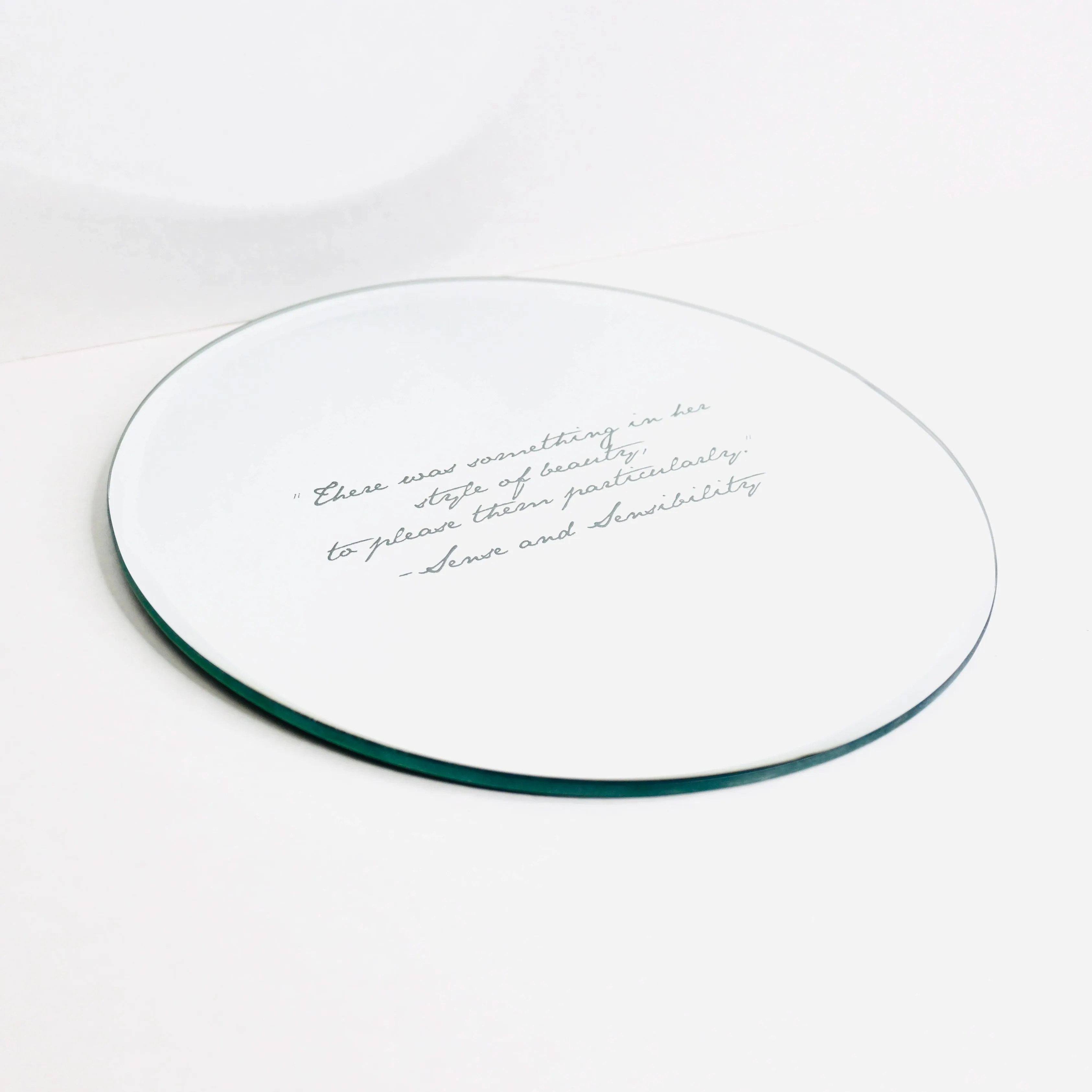 Small Round Wall Mirror with Sense & Sensibility Quote
